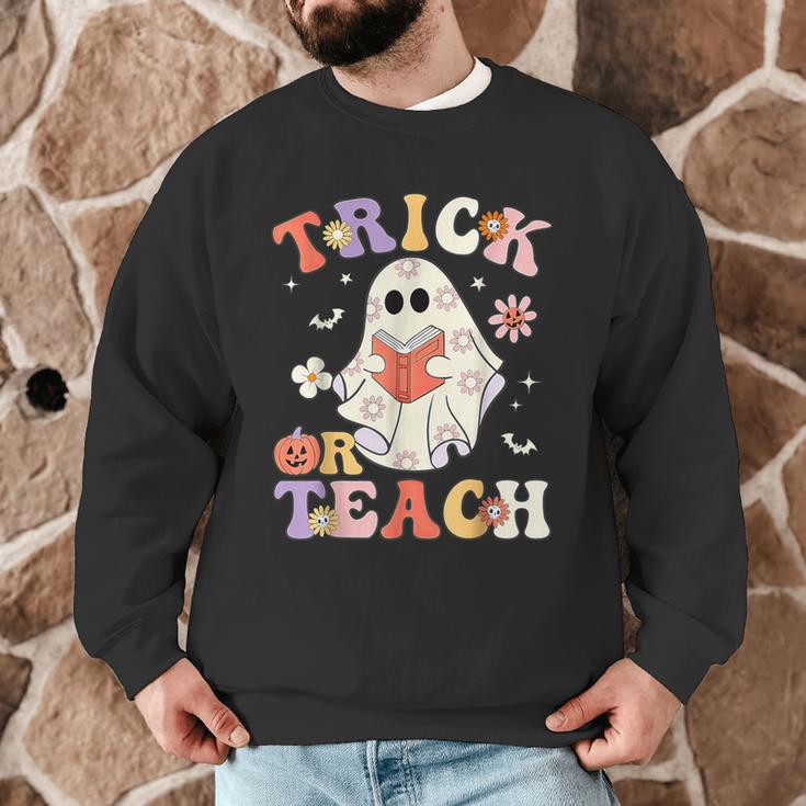 Groovy Halloween Trick Or Teach Retro Floral Ghost Teacher Men Graphic Sweatshirt, novelty gifts, funny gifts Groovy Halloween Trick Or Teach Retro Floral Ghost Teacher Men Graphic Sweatshirt, novelty gifts, funny gifts