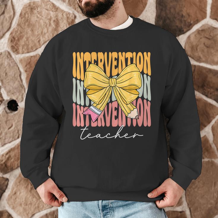 Interventionist Teacher Groovy Coquette Bow Back To School Men Graphic Sweatshirt, novelty gifts, funny gifts