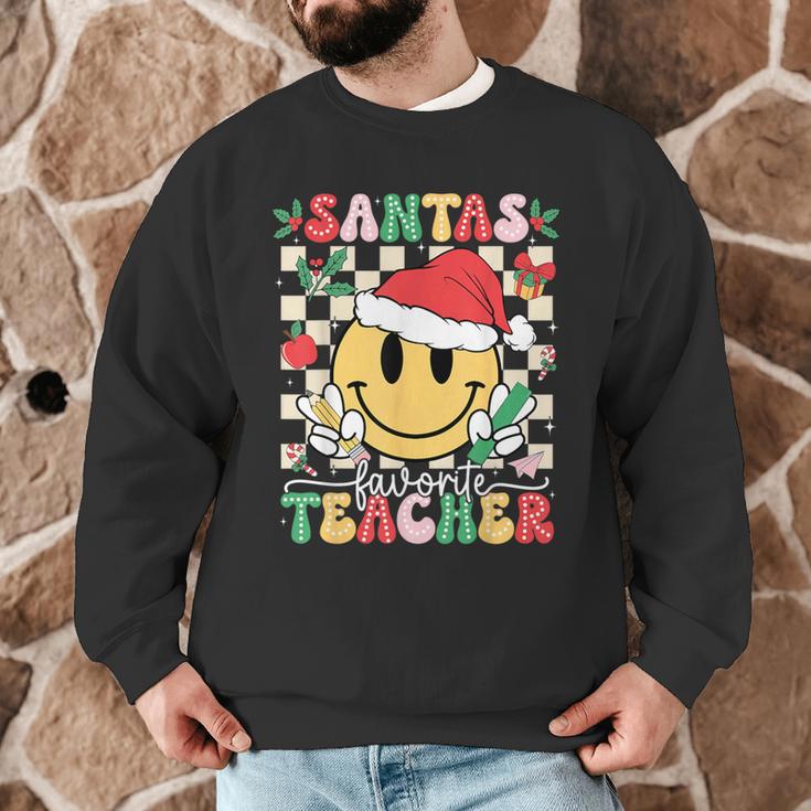 Santas Favorite Teacher Retro Groovy Smile Face Christmas Men Graphic Sweatshirt, novelty gifts, funny gifts