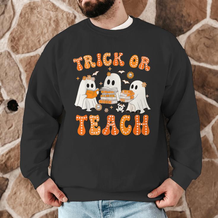 Teacher Halloween Trick Or Teach Retro Groovy Floral Ghost Men Graphic Sweatshirt, novelty gifts, funny gifts Teacher Halloween Trick Or Teach Retro Groovy Floral Ghost Men Graphic Sweatshirt, novelty gifts, funny gifts