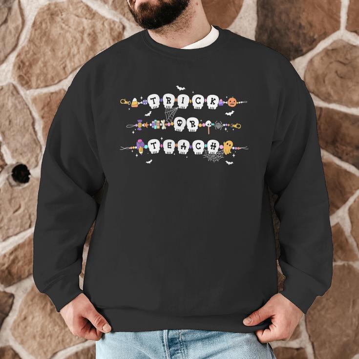 Trick Or Teach Spooky Teacher Happy Halloween Bracelet Men Graphic Sweatshirt, novelty gifts, funny gifts Trick Or Teach Spooky Teacher Happy Halloween Bracelet Men Graphic Sweatshirt, novelty gifts, funny gifts