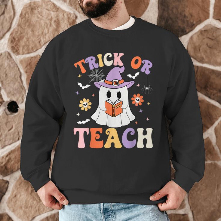 Trick Or Teach Teacher Groovy Ghost Halloween Teacher Men Graphic Sweatshirt, novelty gifts, funny gifts