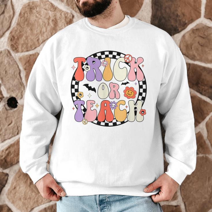 Trick Or Teach Retro Groovy Halloween Teacher Men Graphic Sweatshirt, novelty gifts, funny gifts Trick Or Teach Retro Groovy Halloween Teacher Men Graphic Sweatshirt, novelty gifts, funny gifts