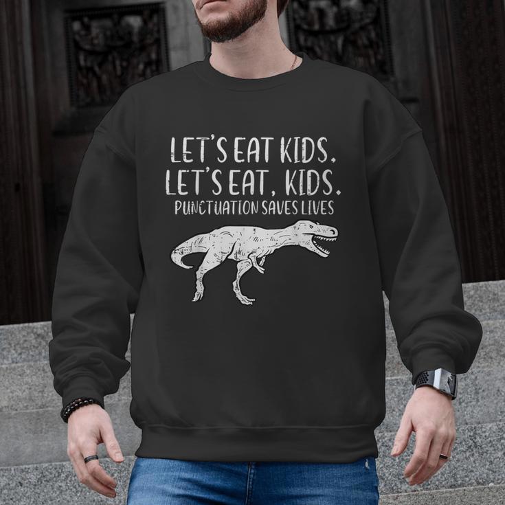 Lets Eat Kids Punctuation Saves Lives Dino Teacher Men Men Graphic Sweatshirt