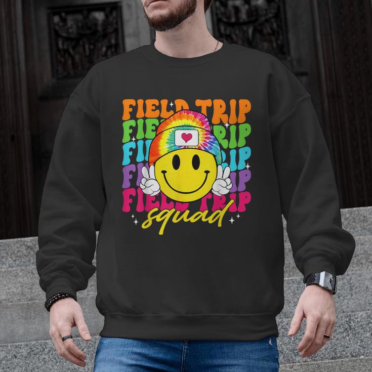 Field Trip Squad Groovy Field Day Smile Face Teacher Tie Dye Men Graphic Sweatshirt