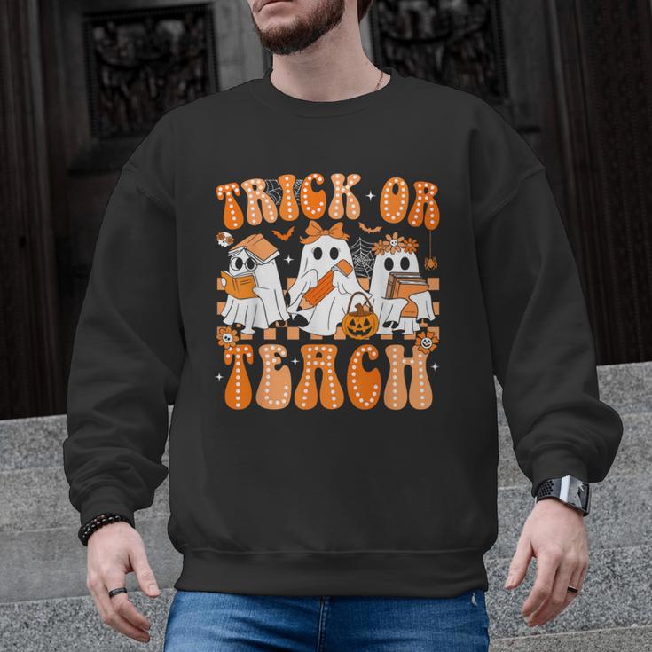 Groovy Teacher Halloween Trick Or Teach Ghost Men Women Kids Men Graphic Sweatshirt