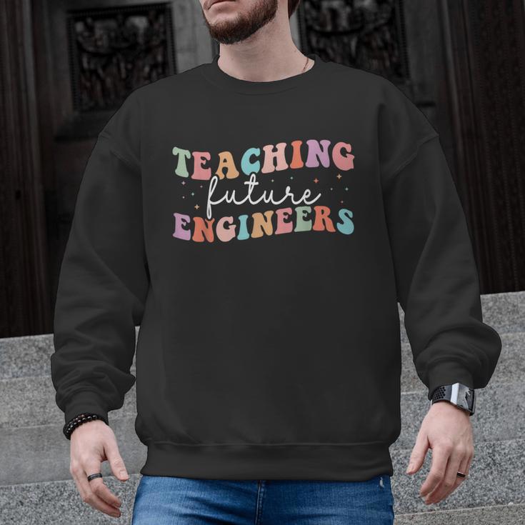 Groovy Teaching Future Engineers Teacher Engineering School Men Women Men Graphic Sweatshirt