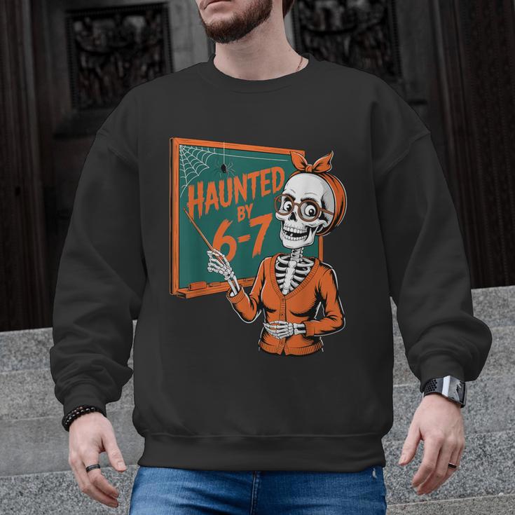 Haunted By 6-7 Six Seven 67 Math Teacher Halloween Skeleton Men Graphic Sweatshirt