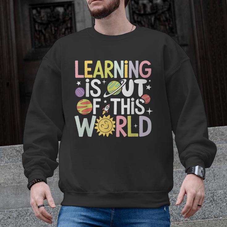 Learning Is Out Of This World Space Teacher Cute Groovy Men Graphic Sweatshirt