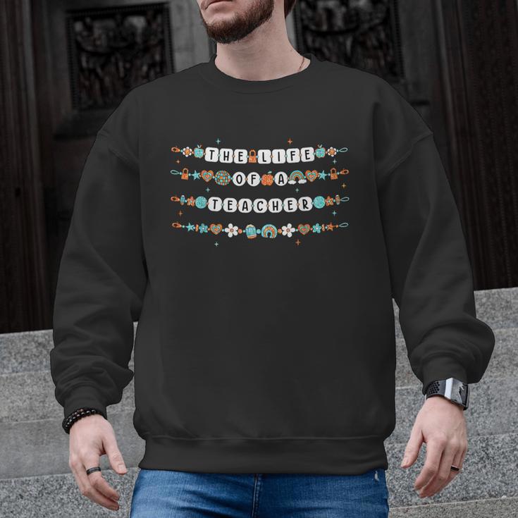The Life Of A Teacher Friendship Bracelets Elementary School Men Graphic Sweatshirt