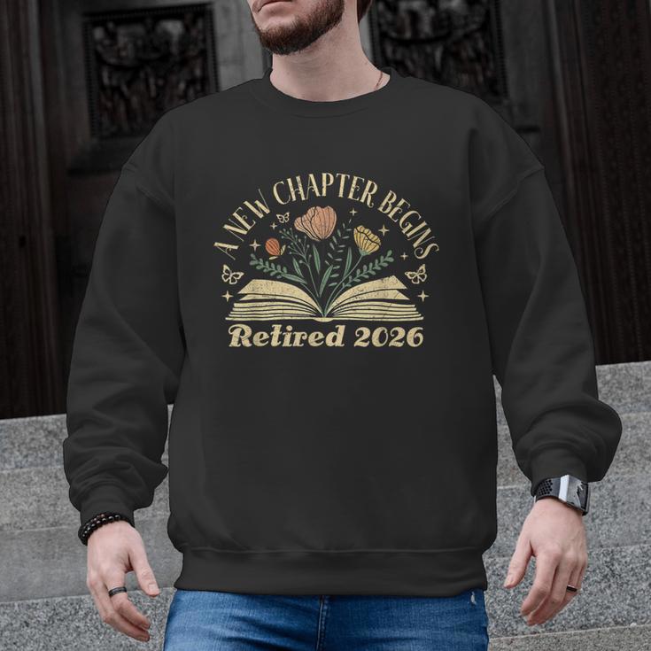 A New Chapter Begins Retired 2026 Teacher Retirement Men Graphic Sweatshirt