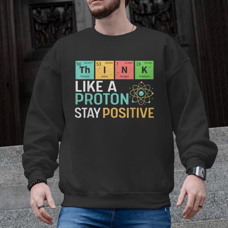 Think Like A Proton Stay Positive Science Teacher Men Graphic Sweatshirt