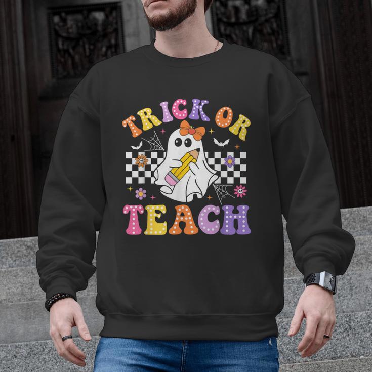 Trick Or Teach Groovy Halloween Teachers Men Graphic Sweatshirt