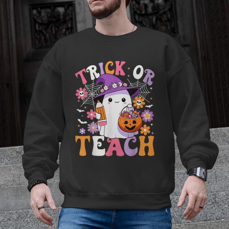 Trick Or Teach Groovy Teacher Ghost Halloween Teacher Men Graphic Sweatshirt