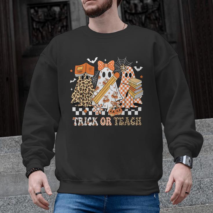 Trick Or Teach Groovy Teacher Halloween Floral Ghost Men Graphic Sweatshirt