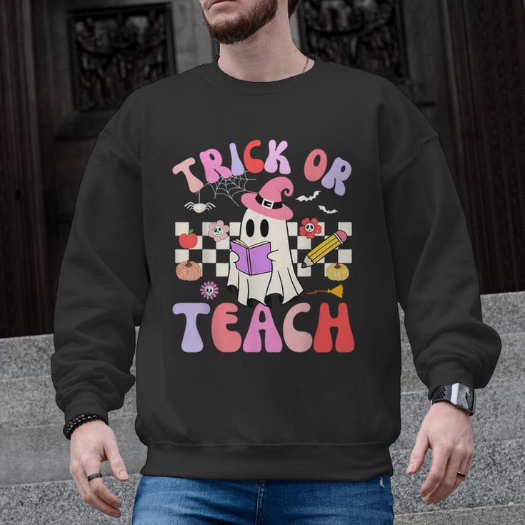 Trick Or Teach Halloween Teacher Floral Ghost Groovy Men Graphic Sweatshirt