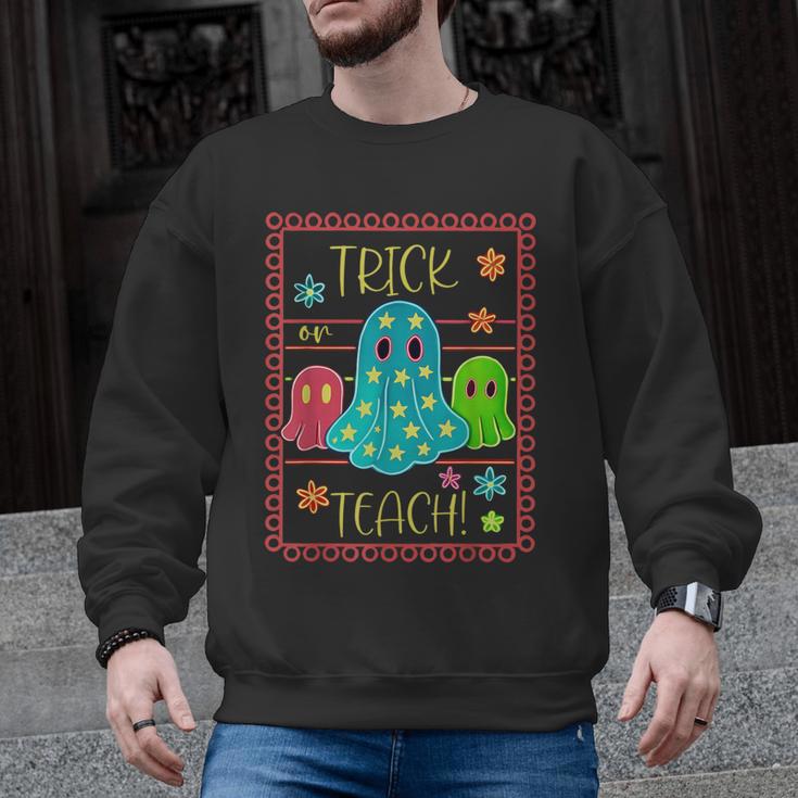 Trick Or Teach Neon Ghost Flower Teacher Spooky Halloween Men Graphic Sweatshirt