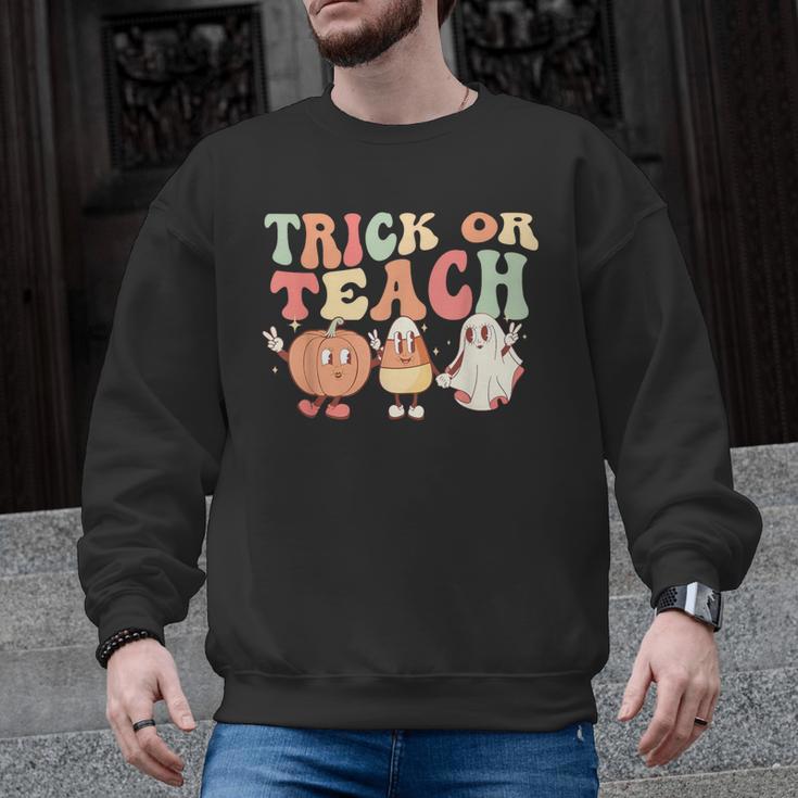Trick Or Teach Pumpkin Candy Corn Ghost Halloween Teacher Men Graphic Sweatshirt