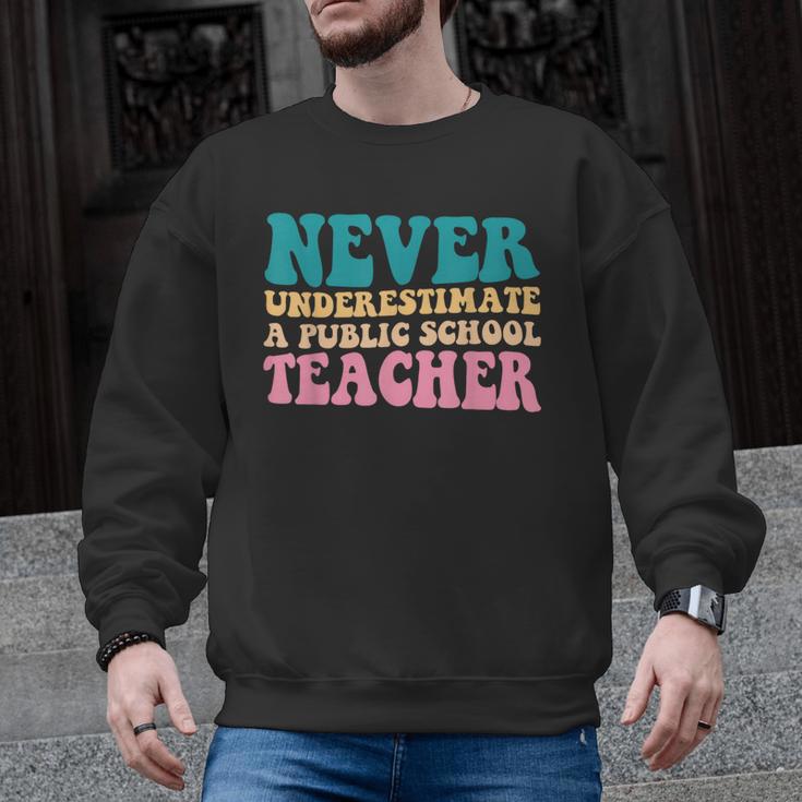 Never Underestimate A Public School Teacher Groovy Women Men Graphic Sweatshirt