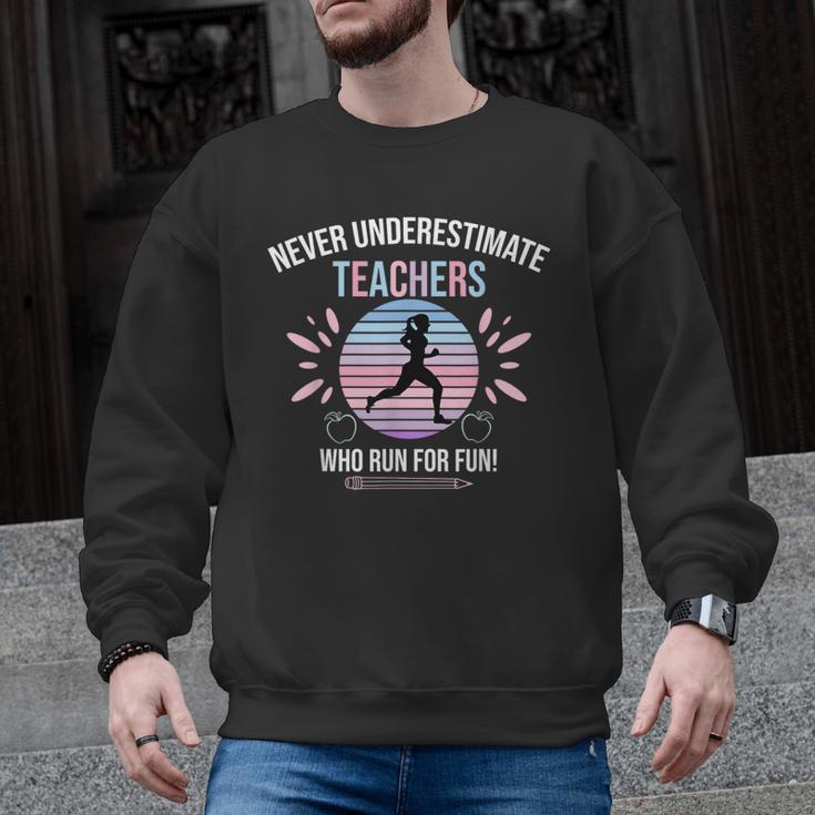 Never Underestimate Teachers Who Runs For Fun Men Graphic Sweatshirt