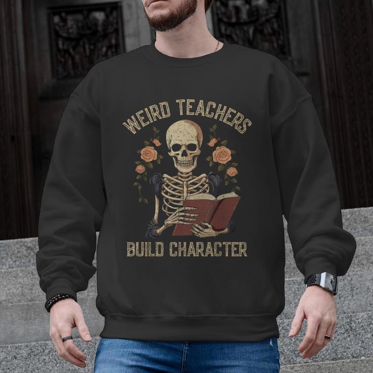 Weird Teachers Build Character Skeleton Book Halloween Women Men Graphic Sweatshirt