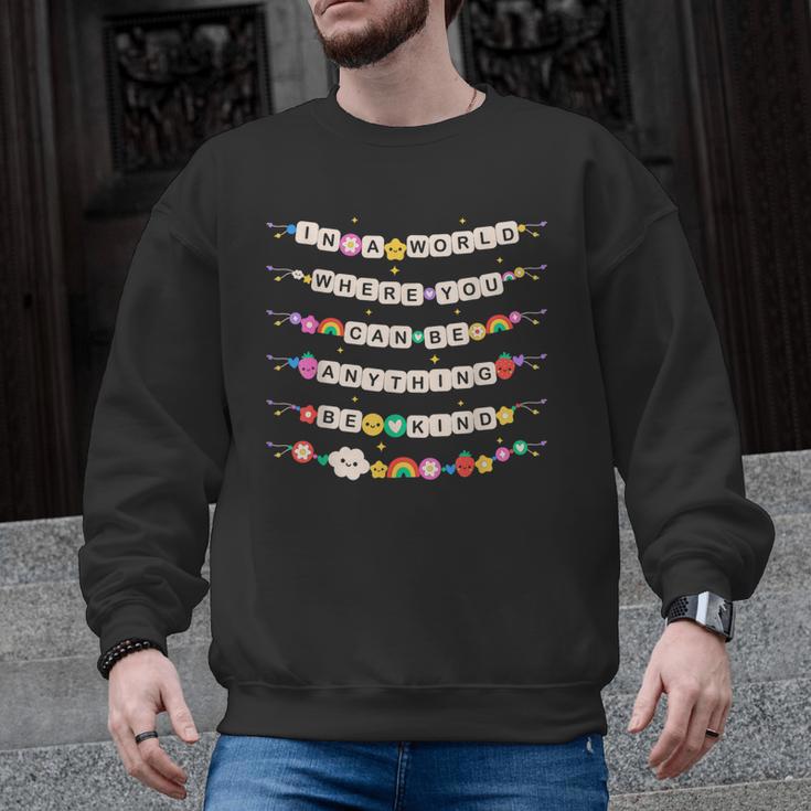 In A World Where You Can Be Anything Be Kind Girls Teachers Men Graphic Sweatshirt