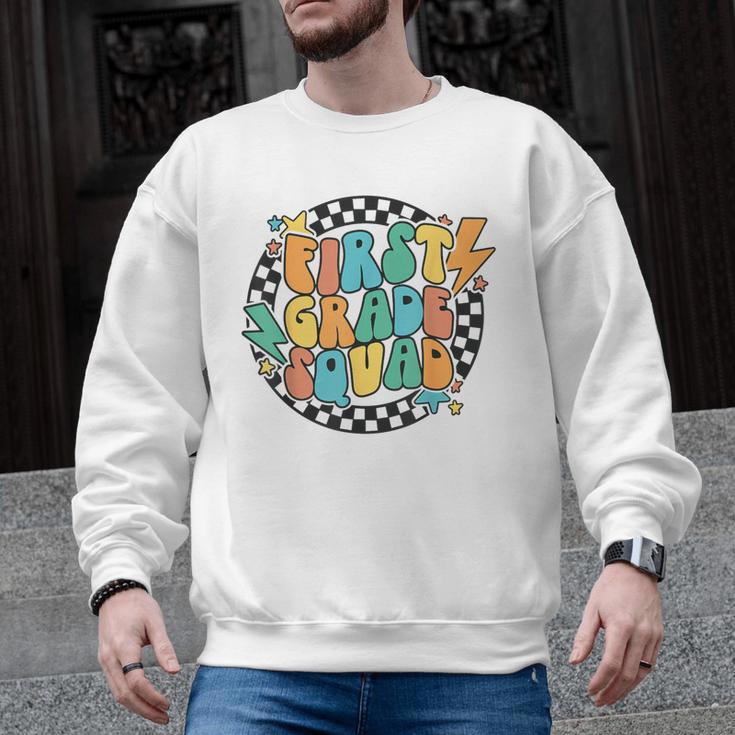 Back To School Groovy Teacher 1st First Grade Crew Squad Men Graphic Sweatshirt