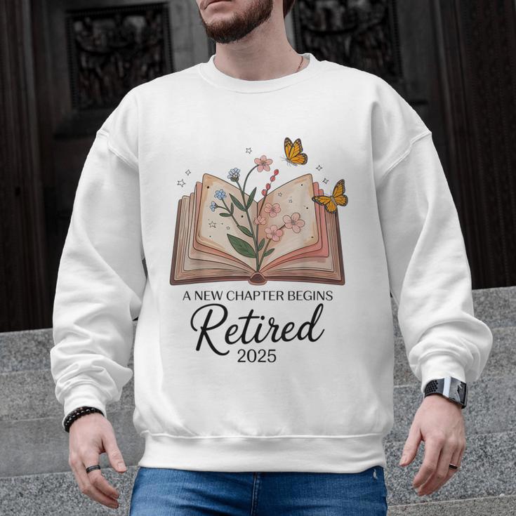 Retired 2025 A New Chapter Begins Retirement Teacher Book Men Graphic Sweatshirt