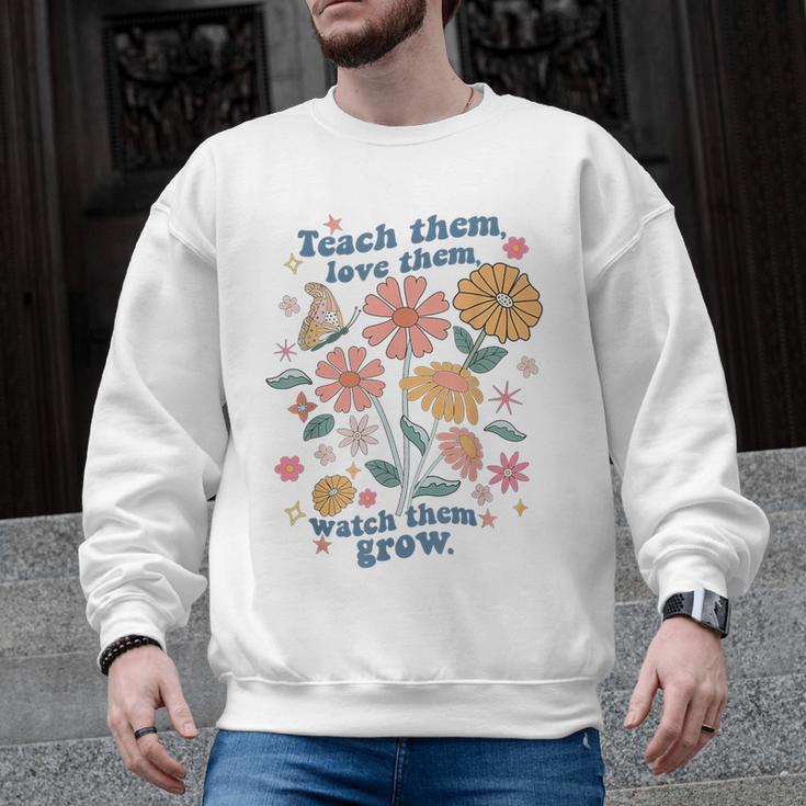 Teach Them Love Them Watch Them Grow Retro Teacher Floral Men Graphic Sweatshirt