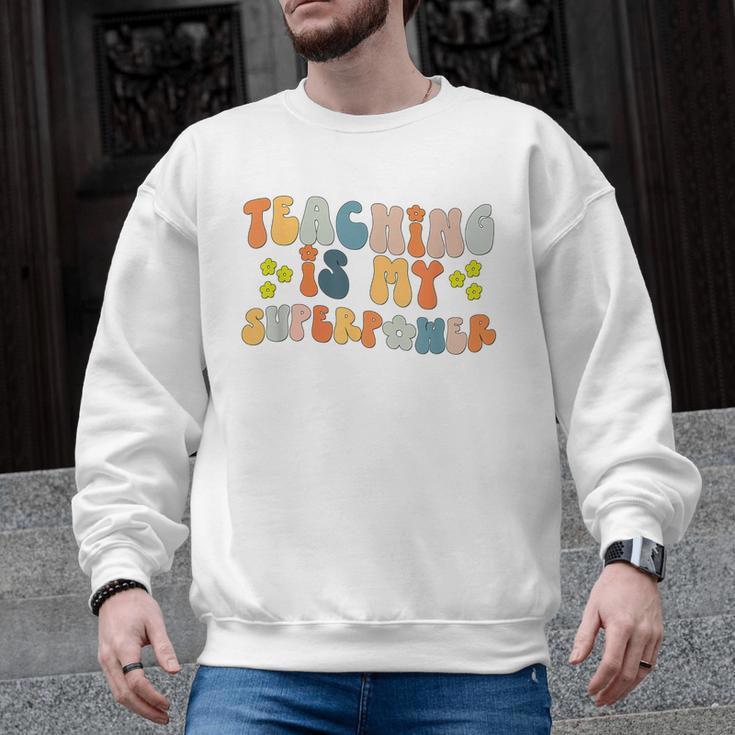 Teaching Is My Superpower Vintage Groovy University Teacher Men Graphic Sweatshirt