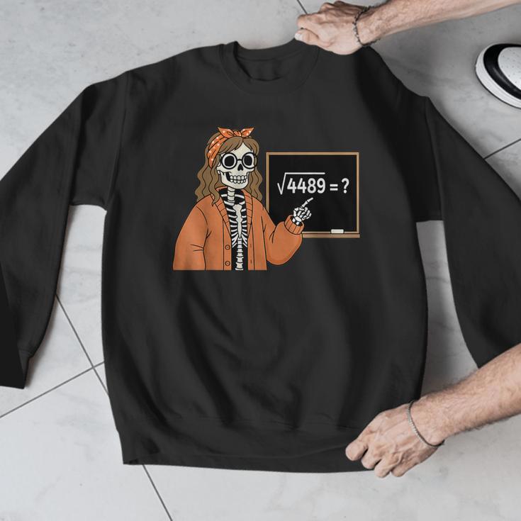 67 Math Teacher Skeleton Halloween Root 4489 Messy Bun Women Men Graphic Sweatshirt, funny design