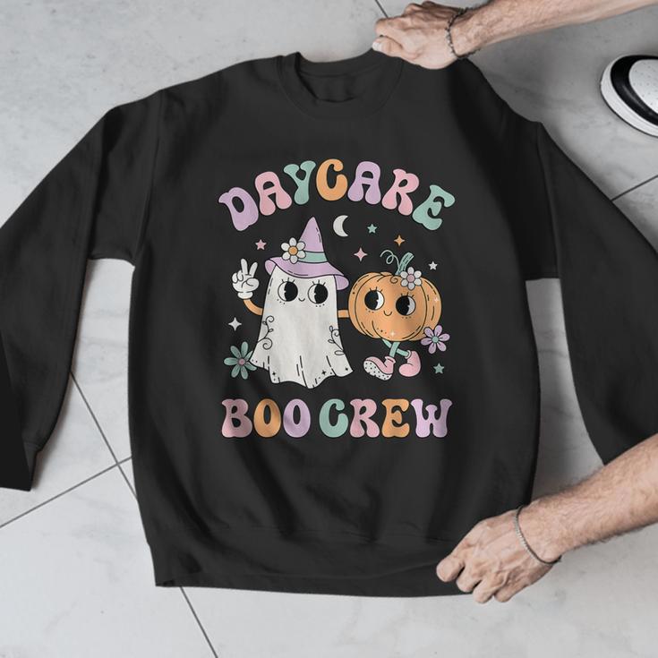 Daycare Boo Crew Groovy Halloween Floral Ghost Kid Teacher Men Graphic Sweatshirt, Groovy Teacher Gifts, funny design