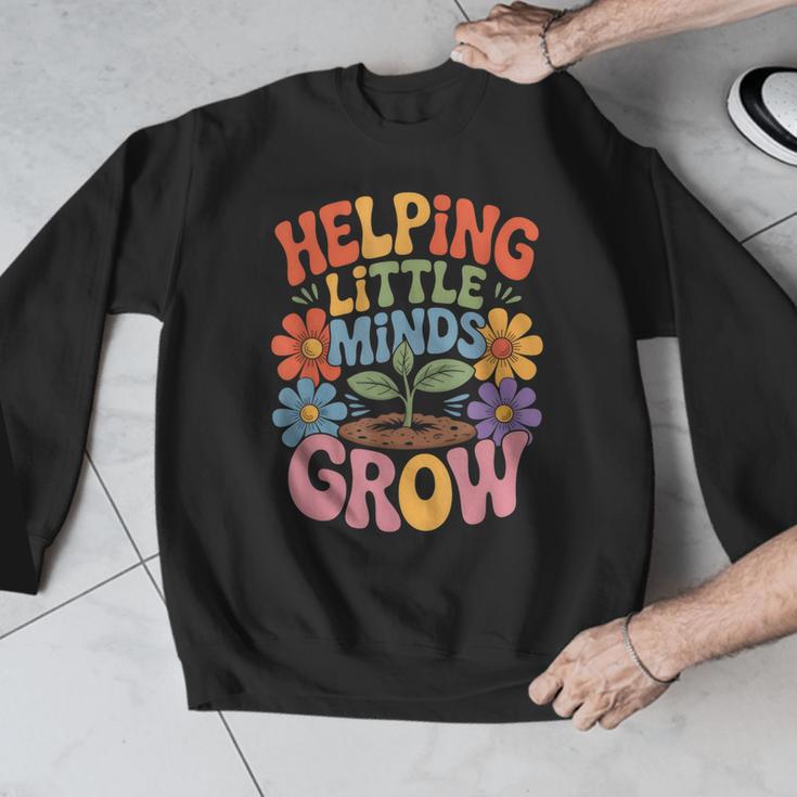 Helping Little Minds Grow Teacher First Day Back To School Men Graphic Sweatshirt, funny design