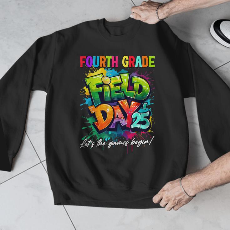 Let The Games Begin Fourth Grade Field Day 2025 Teacher Kid Men Graphic Sweatshirt, funny design Let The Games Begin Fourth Grade Field Day 2025 Teacher Kid Men Graphic Sweatshirt, funny design