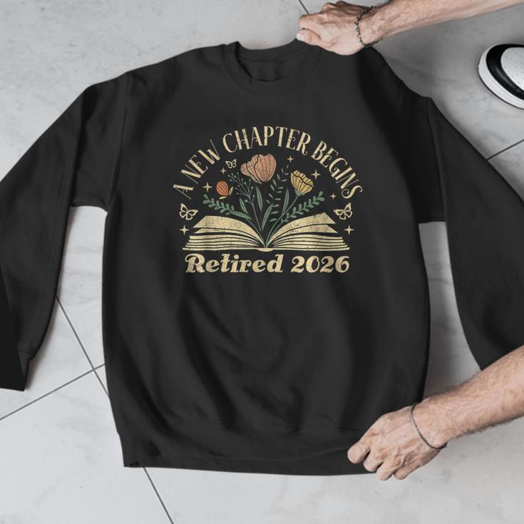 A New Chapter Begins Retired 2026 Teacher Retirement Men Graphic Sweatshirt, funny design A New Chapter Begins Retired 2026 Teacher Retirement Men Graphic Sweatshirt, funny design