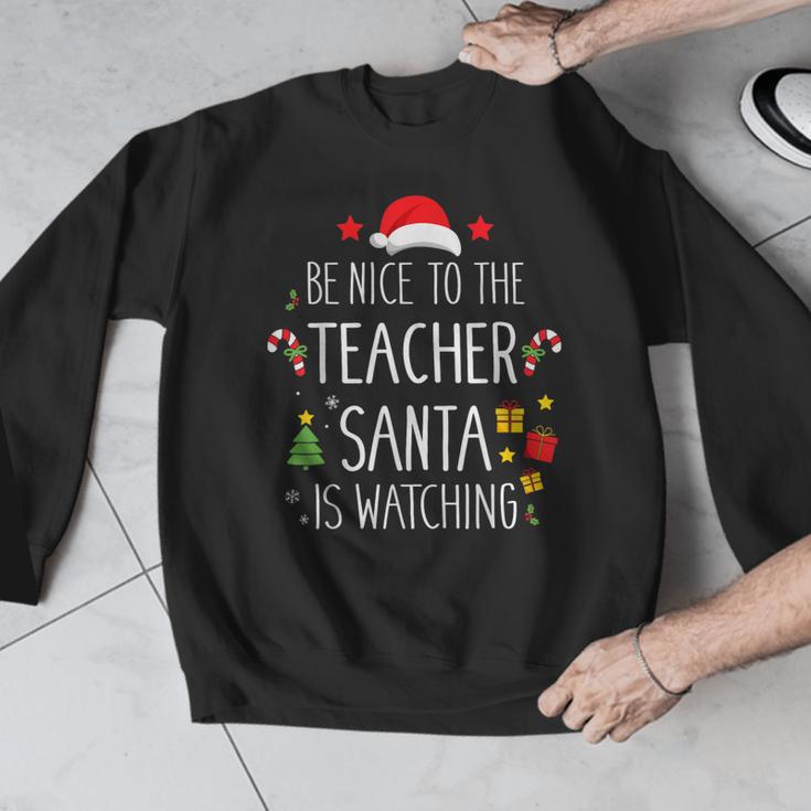 Be Nice Teacher Santa Watching Xmas School Students For Men Women Men Graphic Sweatshirt, funny design