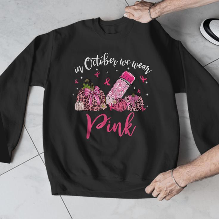 In October We Wear Pink Apple Teacher Daisy Breast Cancer Men Graphic Sweatshirt, funny design
