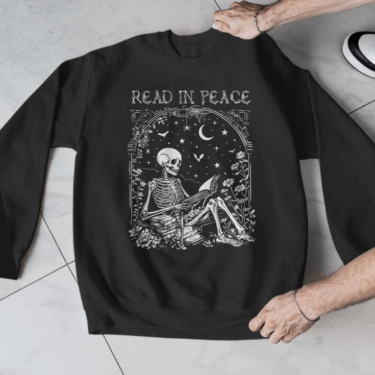 Read In Peace Skeleton Reading Teacher Spooky Halloween Men Graphic Sweatshirt, funny design Read In Peace Skeleton Reading Teacher Spooky Halloween Men Graphic Sweatshirt, funny design