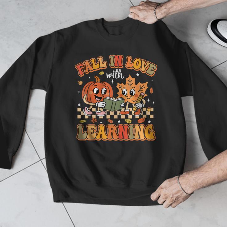 Retro Fall In Love With Learning Autumn Pumpkin Teachers Men Graphic Sweatshirt, funny design