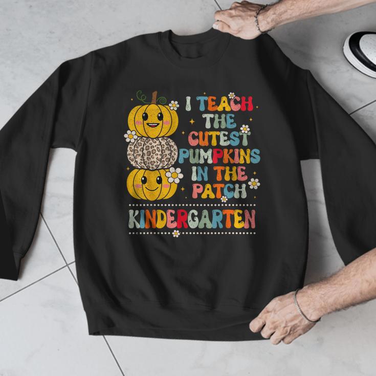 I Teach The Cutest Pumpkins Kindergarten Teacher Halloween Men Graphic Sweatshirt, funny design