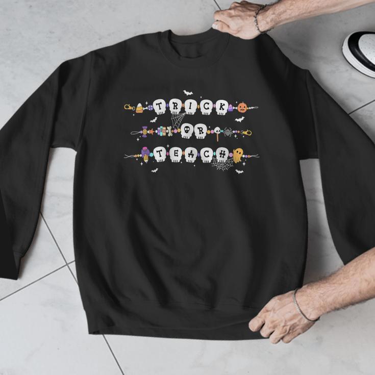 Trick Or Teach Spooky Teacher Happy Halloween Bracelet Men Graphic Sweatshirt, funny design Trick Or Teach Spooky Teacher Happy Halloween Bracelet Men Graphic Sweatshirt, funny design
