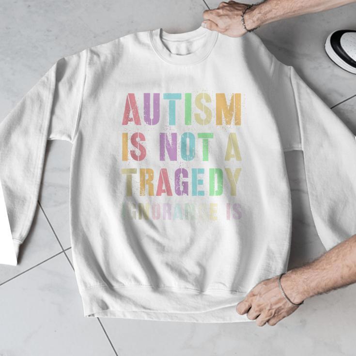 Kids AUTISM IS NOT A TRAGEDY IGNORANCE IS Proud Teacher Crew Men Graphic Sweatshirt, funny design