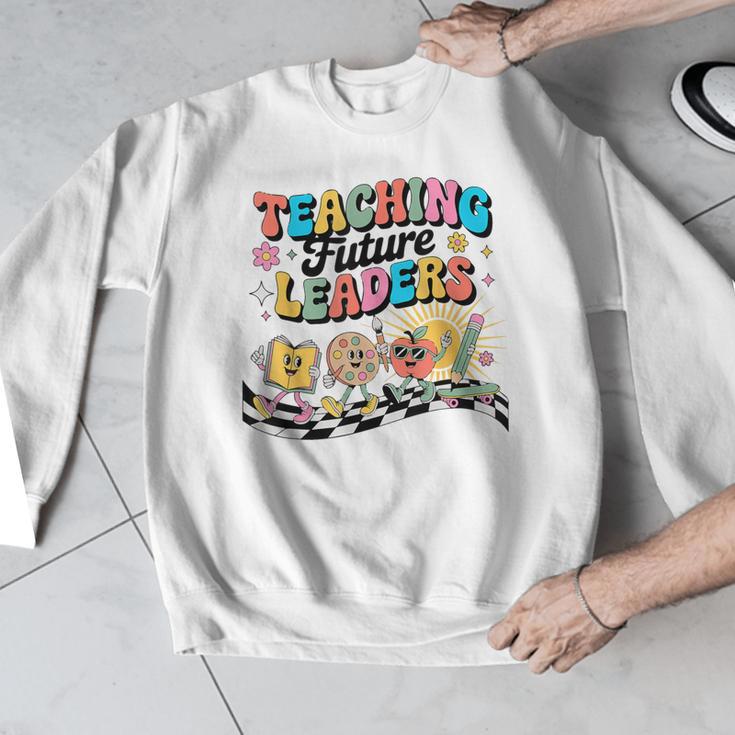 Retro Teaching Future Leaders Groovy Teacher Back To School Men Graphic Sweatshirt, Future Teacher Gifts, Groovy Teacher Gifts, funny design
