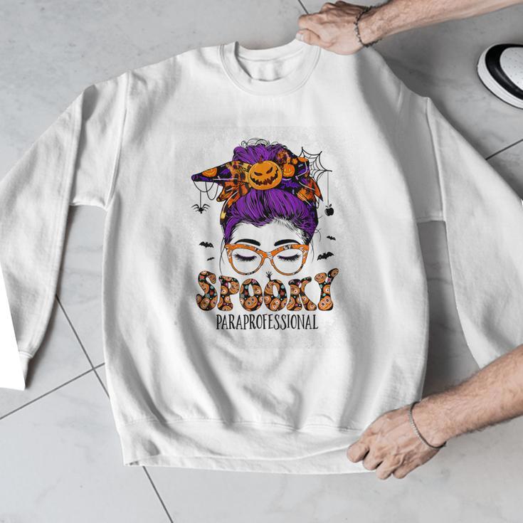 Spooky Paraprofessional Life Halloween Messy Bun Teacher For Men Women Men Graphic Sweatshirt, funny design