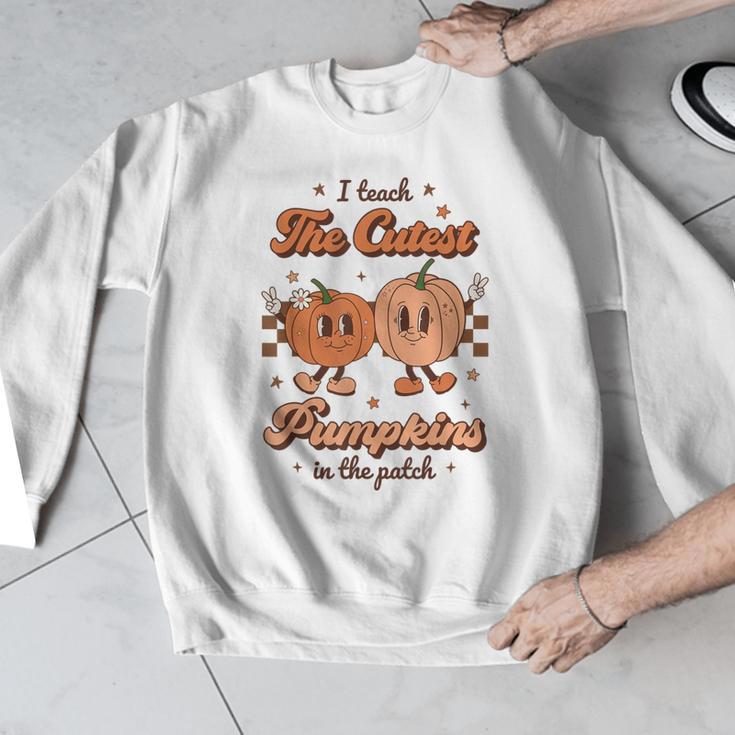 I Teach The Cutest Pumpkins In The Patch Retro Teacher Fall Men Graphic Sweatshirt, funny design