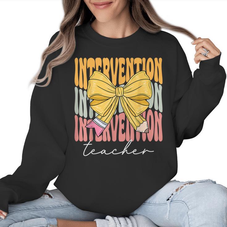 Interventionist Teacher Groovy Coquette Bow Back To School Women Crewneck Sweatshirt