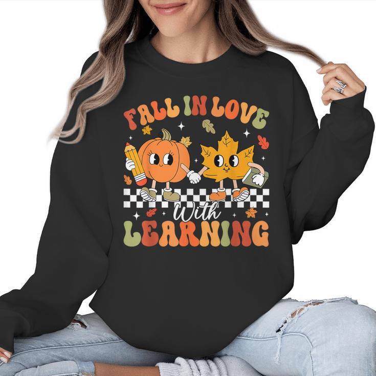 Retro Pumpkin Fall In Love With Learning Autumn Teacher Women Crewneck Sweatshirt