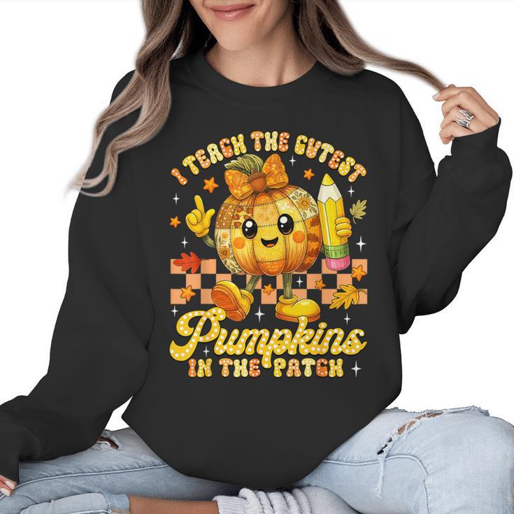 I Teach The Cutest Pumpkins In The Patch Teacher Halloween Women Crewneck Sweatshirt