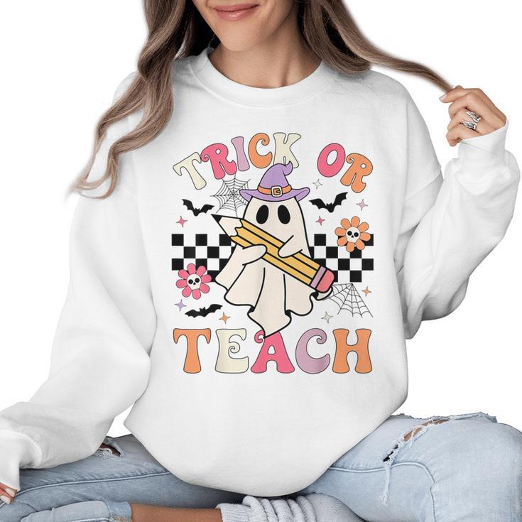 Trick Or Teach Groovy Teacher Halloween Retro Floral Ghost Women Crewneck Sweatshirt