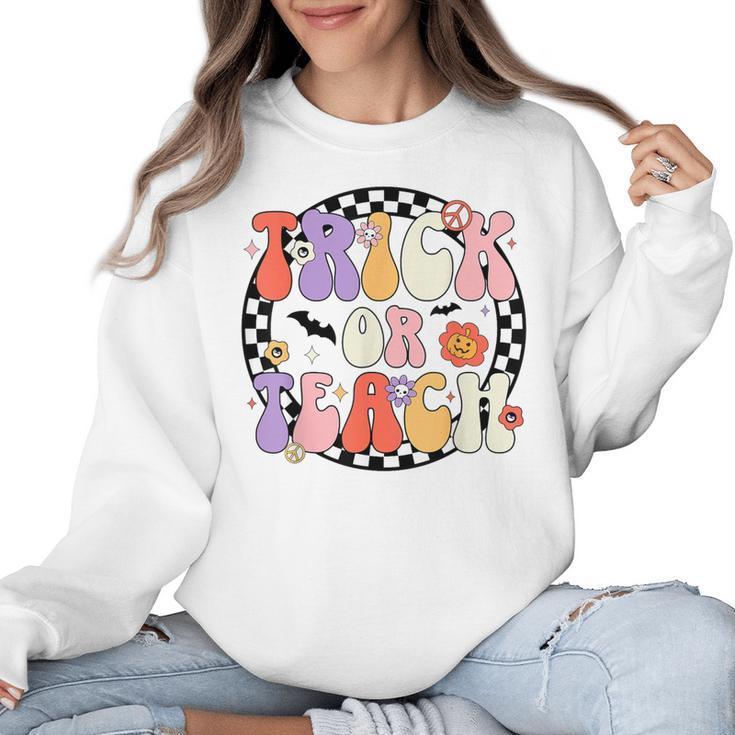 Trick Or Teach Retro Groovy Halloween Teacher Women Crewneck Sweatshirt